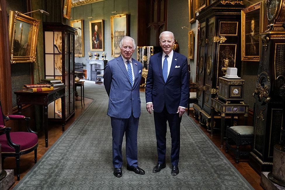 King Charles and U.S President Joe Biden in the Grand Corridor at Windsor Castle, Berkshire, on 10 July 2023