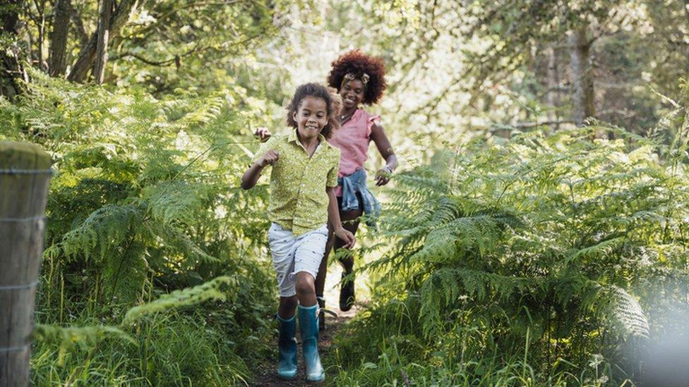 kids running in woods