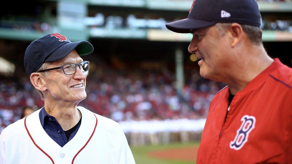 Apple chief executive Tim Cook, left, with Red Sox field manager John Farrell