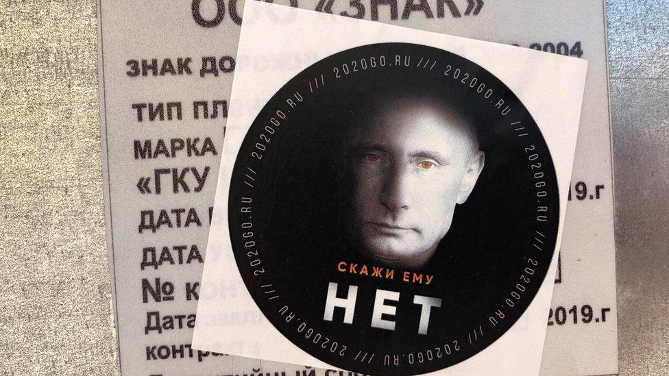 This anti-Putin sticker reads "Tell him NO"