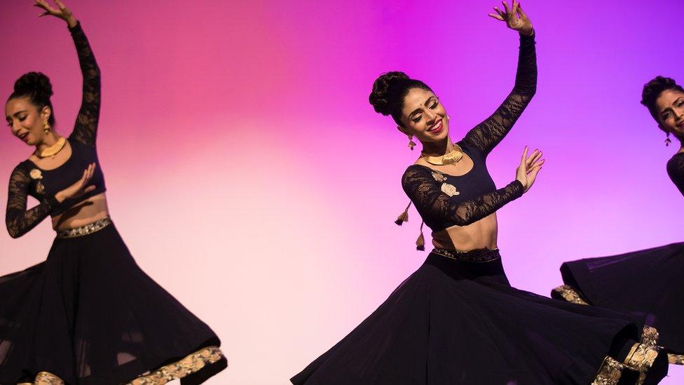 Payal Kadakia (centre) dancing