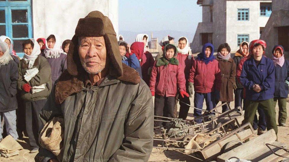 People in rural North Korea wait for food aid during a famine in 1995.