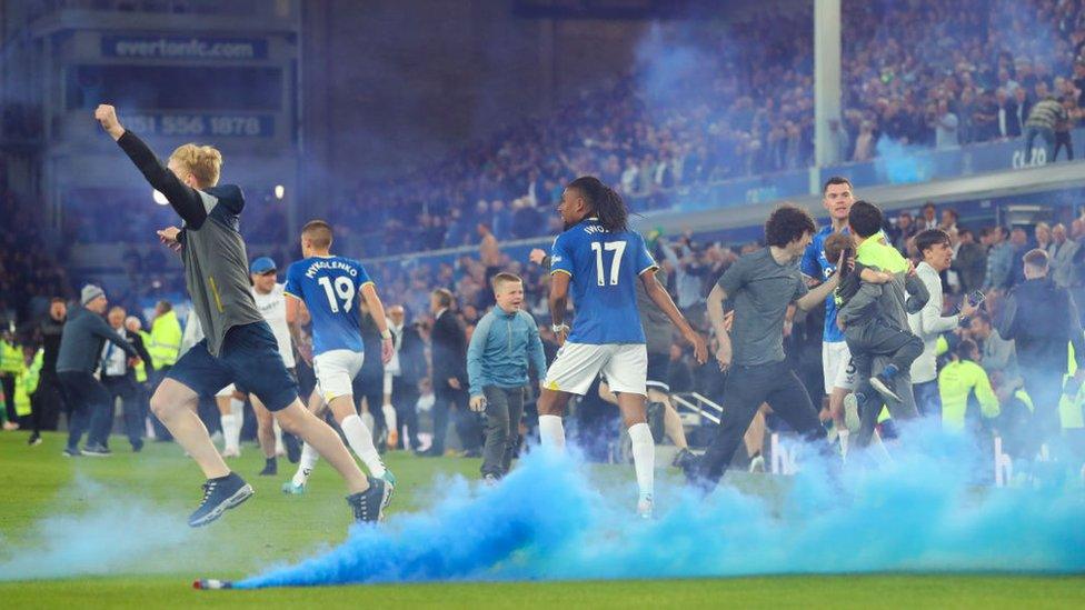 Everton fans on the pitch