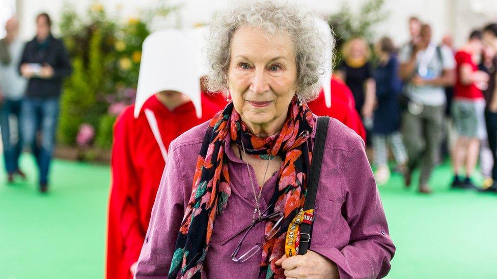 Margaret Atwood, The author of The Handmaid's Tale Walks though the Hay festival followed by handmaids from here famous book