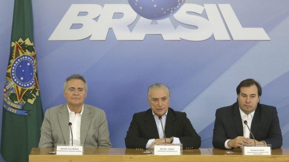 Senator Renan Calheiros (left) and Chamber of Deputies Speaker Rodrigo Maia joined Mr Temer at the press conference