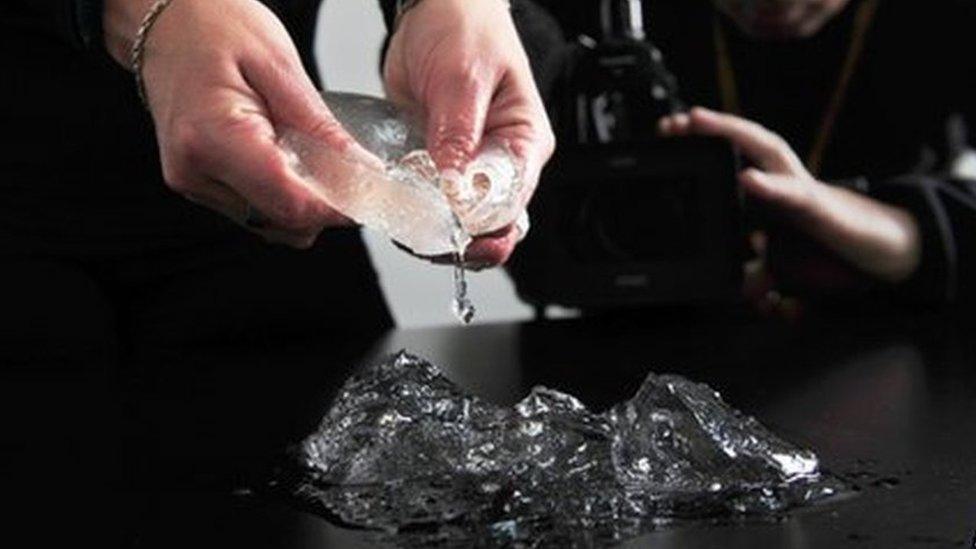 Virginia Moon, lawyer of Argentine women in the lawsuit for defective Poly Implant Prothese (PIP) French-made breast implants, shows one of them in her office at the district courts during a press conference