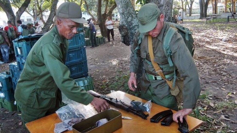 Members of an Infantry Company of the Cuban Revolutionary Armed Forces (FAR), receive weapons as part of the Bastion 2013 military exercises in Ciego de Avila province, Cuba on November 19, 2013