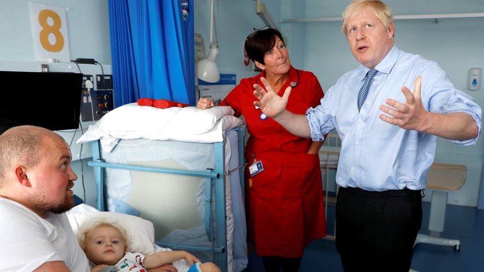 Boris-Johnson-visits-a-young-child-in-hospital.