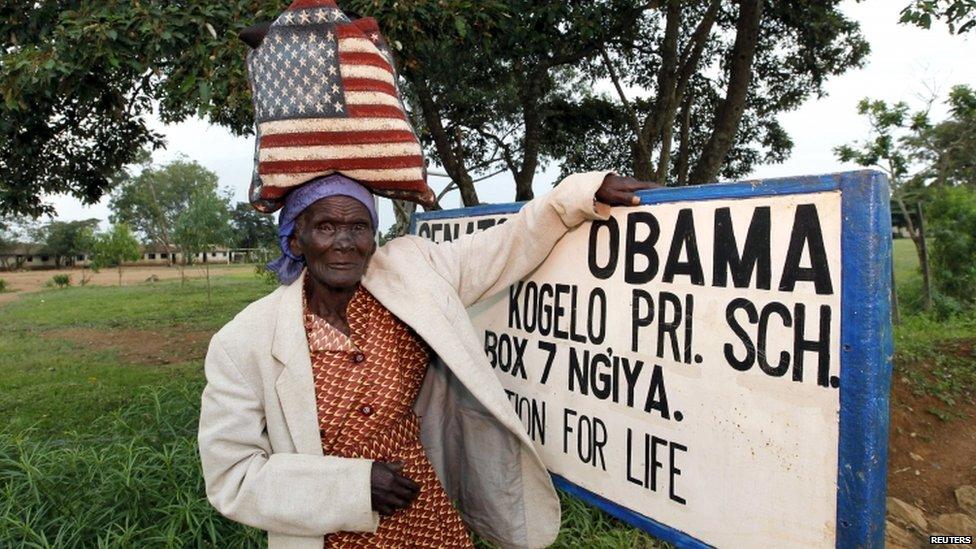 Woman in front of Obama sign