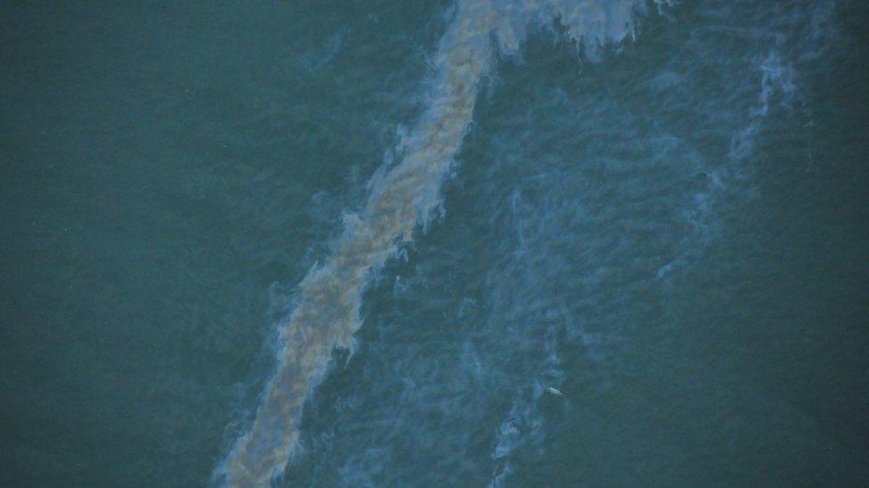 An aerial photo of oil in the water