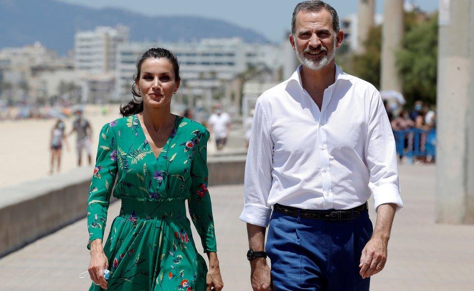 Queen Letizia (L) and King Felipe VI (R) of Spain, greet tourists as they walk along El Arenal promenade in Palma de Mallorca, Spain, 25 June 2020