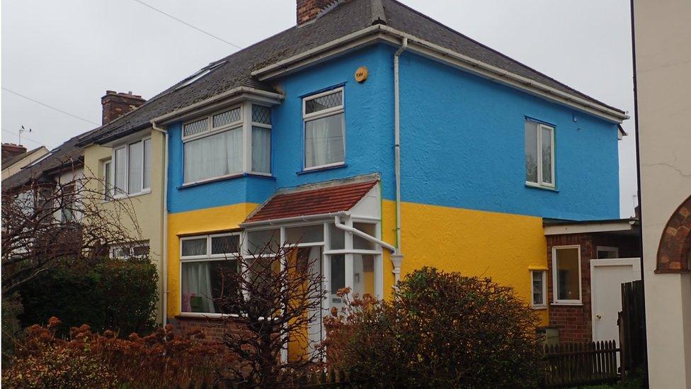 House painted blue and yellow