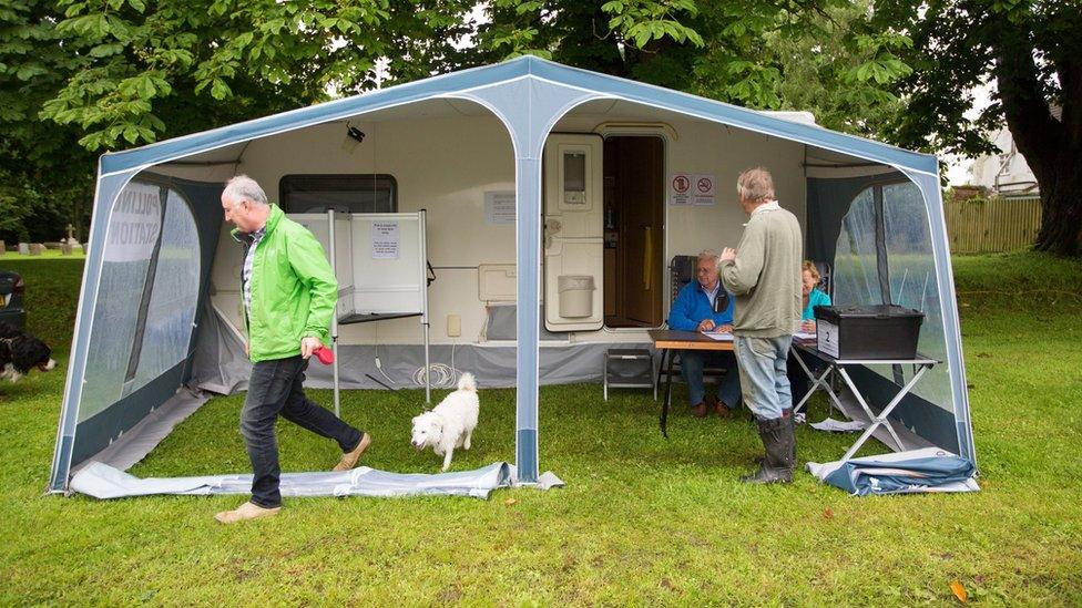 People voting in the European referendum at the polling station caravan in the village of Carlton, Cambridgeshire