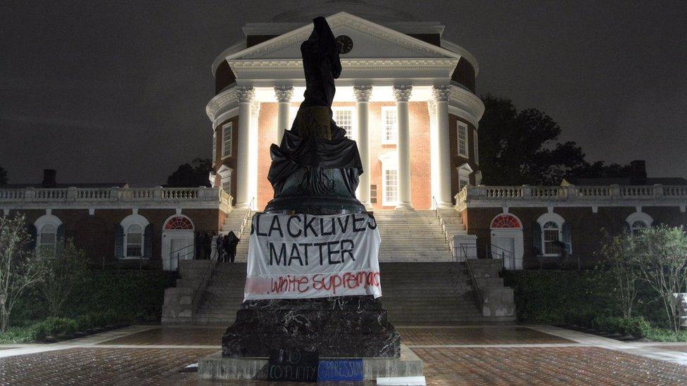 Picture shows the statue of Thomas Jefferson covered in Charlottesville