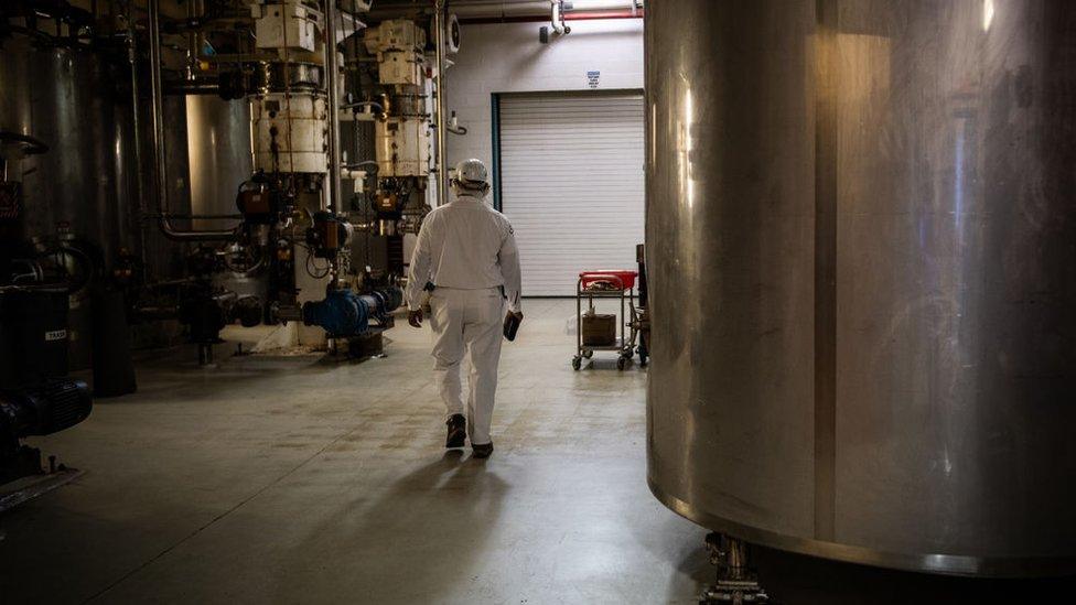 A worker seen near a tank at the Mars Wrigley factory in Elizabethtown, Pennsylvania