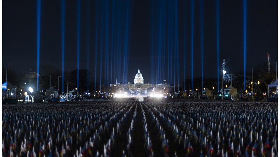 The pillars of light illuminate the night sky of the National Mall in Washington, D.C.