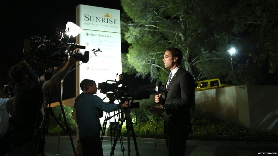 Reporters outside hospital