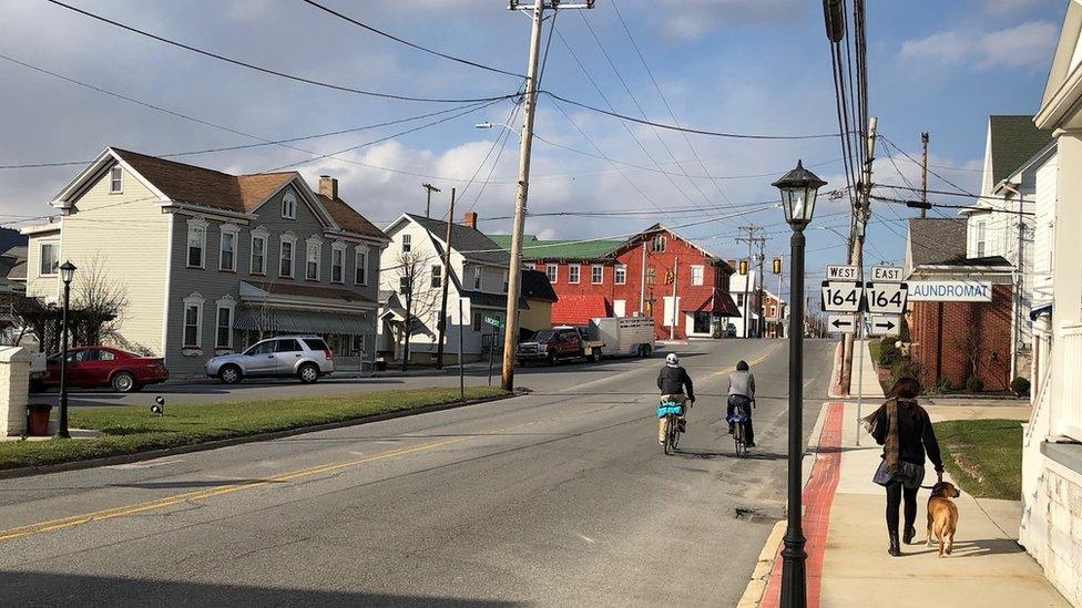 Martinsburg - person and dog walking down street