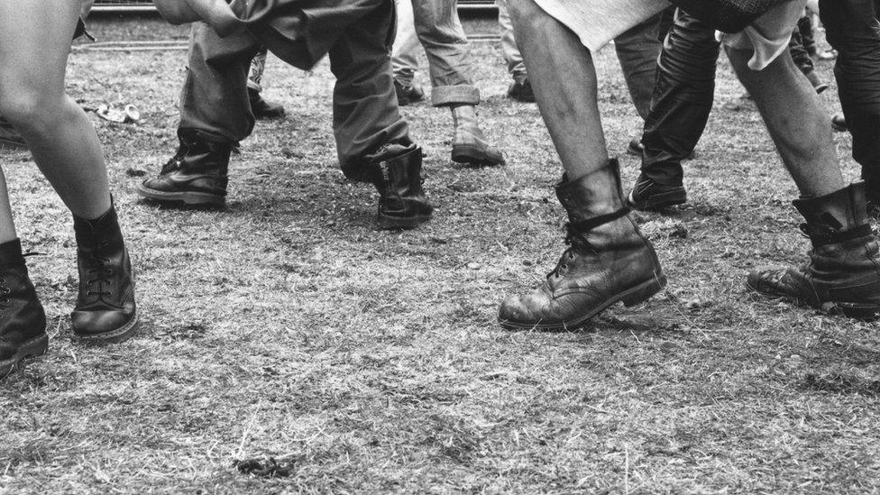 People wearing Dr Marten boots dancing at the Deptford Free Festival in south London, July 1993