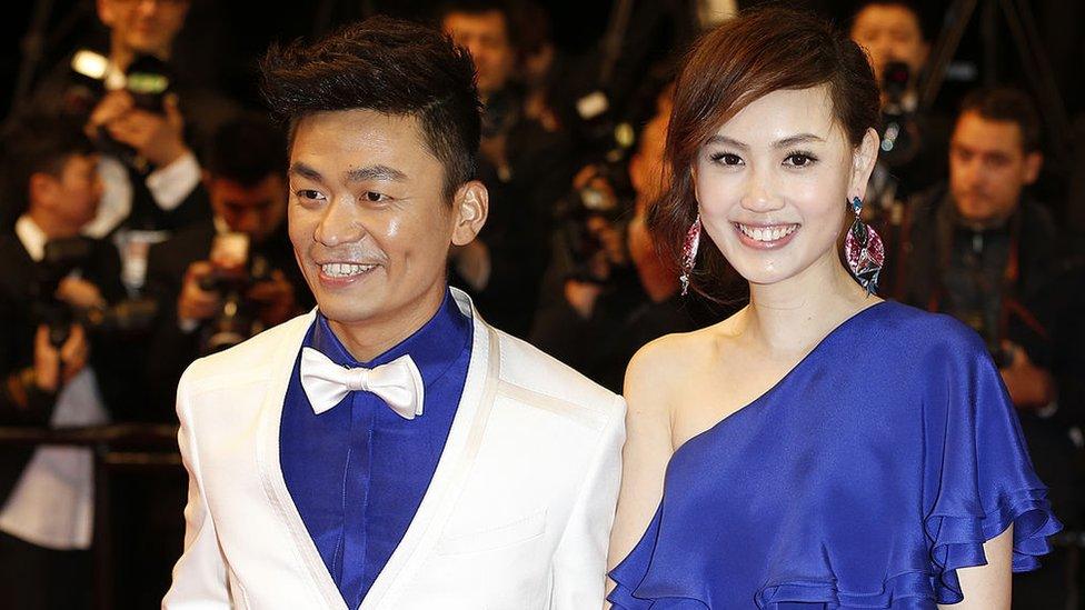 Chinese actor Wang Baoqiang (L) and his wife Ma Rong pose on May 17, 2013 as they arrive for the screening of the film 'Tian Zhu Ding'