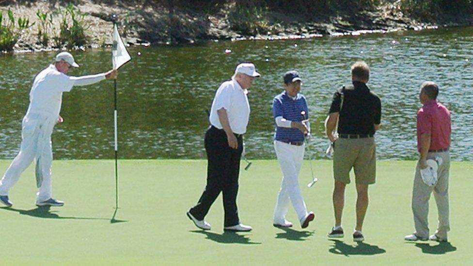 Abe and Trump, shown on the Florida course, both love golf