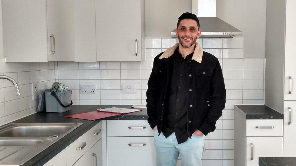 Jimmy Capucho Amaro standing in his new kitchen