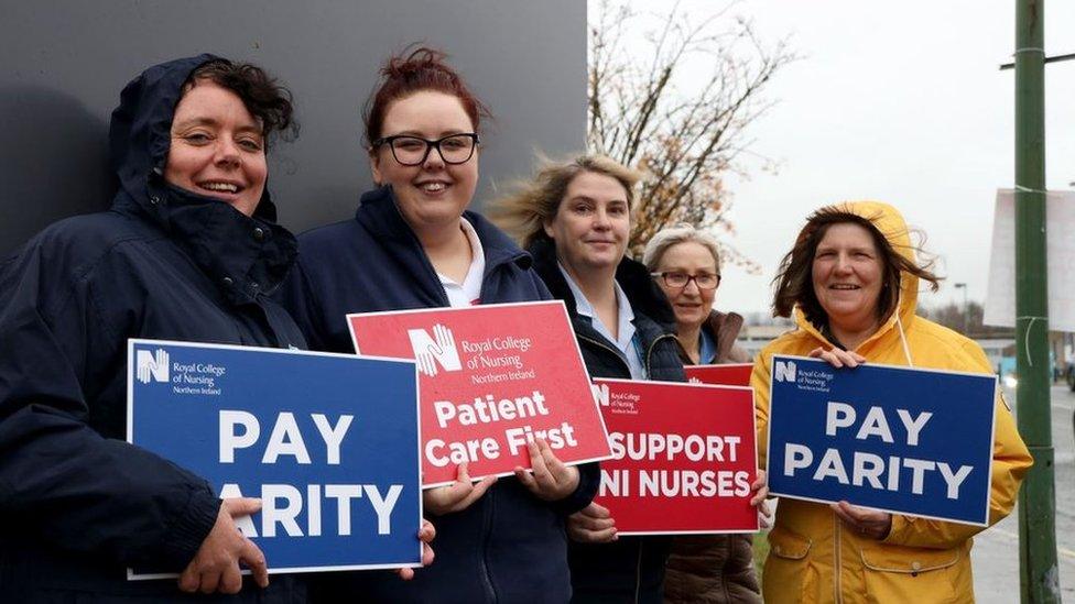 Nurses holding placards on a picket line