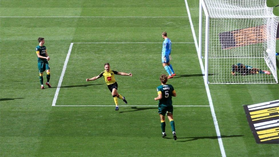 A Harrogate Town player celebrates