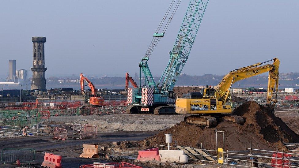 view of stadium construction by the River Mersey