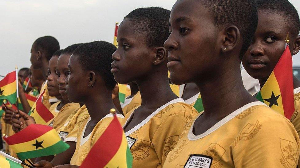 Students of the KG St Mary's school wait for the arrival of the president of Ghana