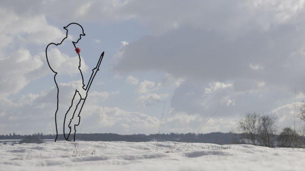 Snow Tommy: one of the figures on a white landscape