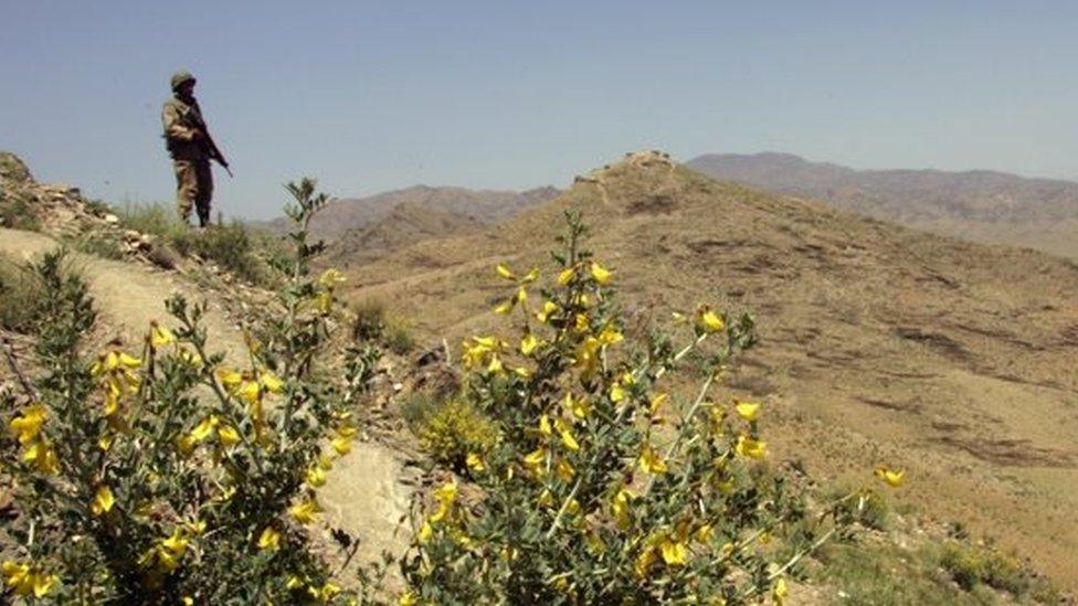 A Pakistani army soldier guards a hilltop position at a military outpost near Wana April 11, 2007 in Pakistan"s South Waziristan tribal area near the Afghan border.