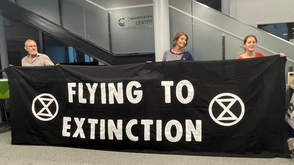 Members of Extinction Rebellion at an airport drop-in event in Farnborough on 20.9.23