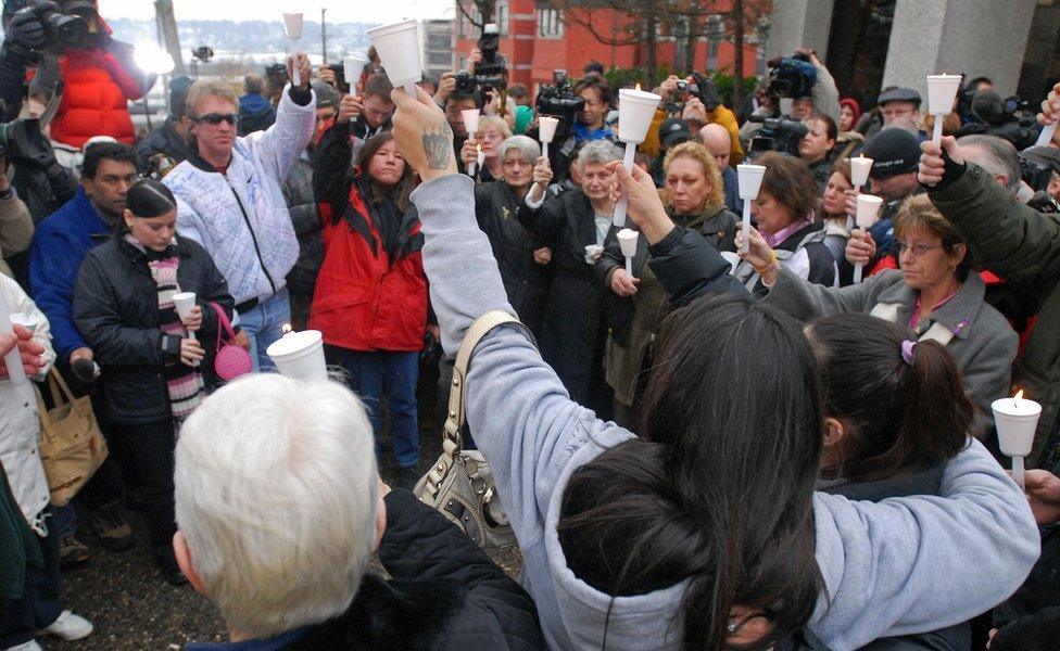 Friends and family members of some of Picton's victims hold a vigil