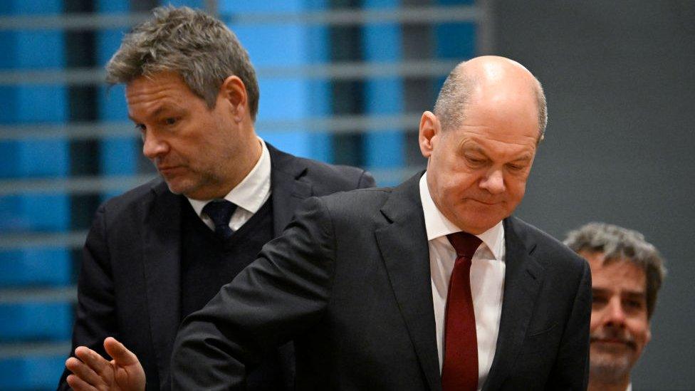 German Chancellor Olaf Scholz (L) and German Minister of Economics and Climate Protection Robert Habeck take a seat as with Brazilian President and other ministers they attend a plenary session of the second German-Brazilian government consultations at the Chancellery in Berlin, Germany on December 4, 2023