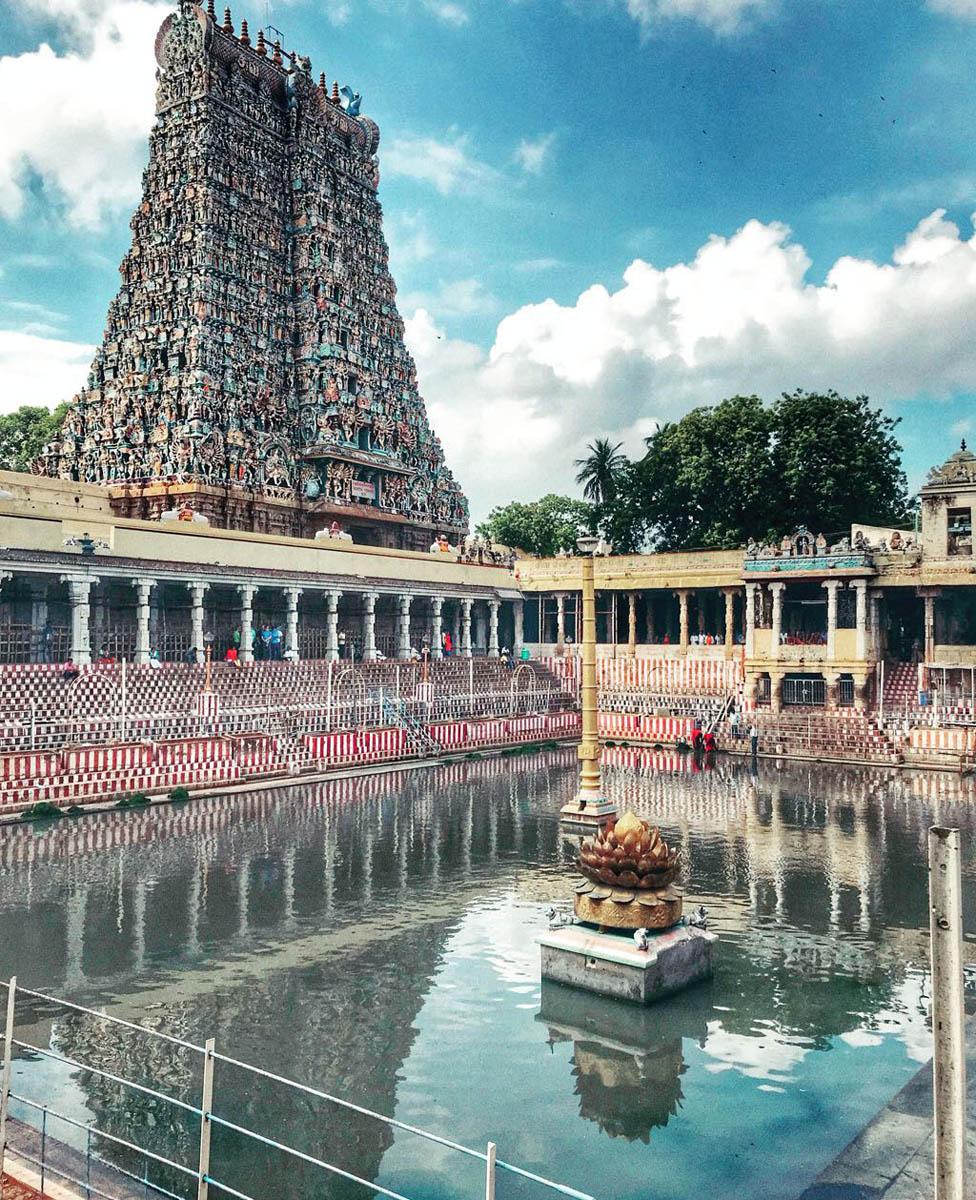 Temple courtyard, water in the middle and lotus plant statue