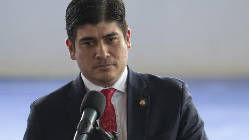 President of Costa Rica Carlos Alvarado at a microphone