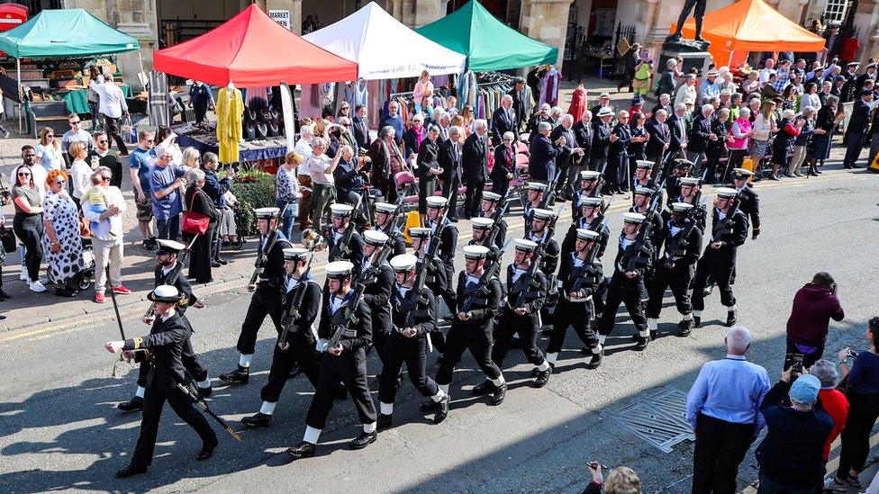 The parade marches through the town