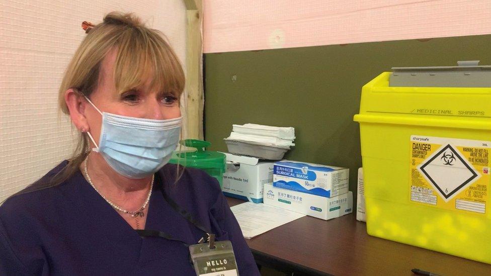 Lady sat in pod with medical equipment around her