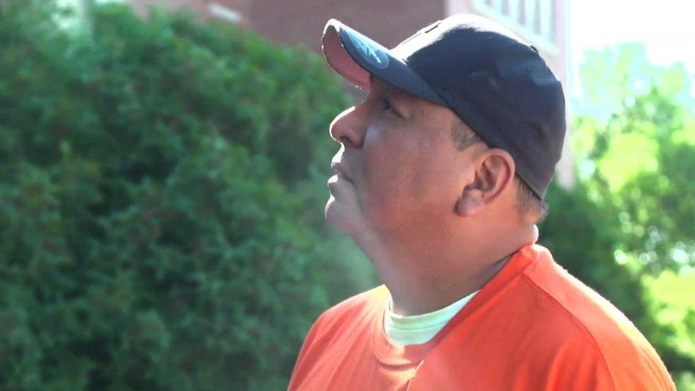 Residential school survivor Isadore Poorman in front of the former institution