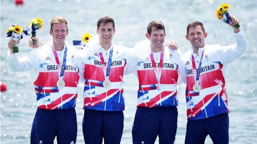 Harry Leask, Angus Groom, Tom Barras and Jack Beaumont collect their silver medals for the Men's Quadruple Sculls in Tokyo