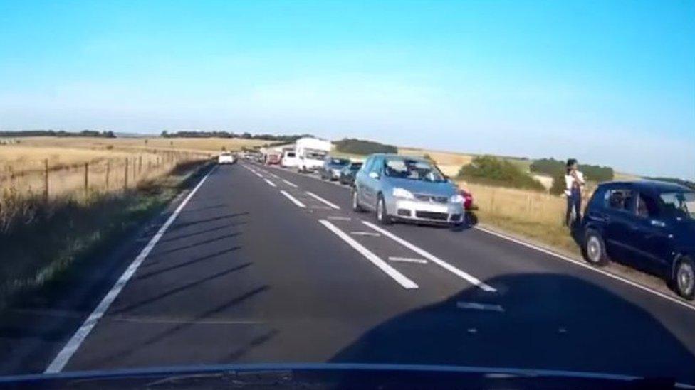 Cars parked near Stonehenge