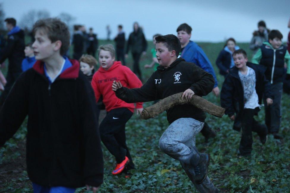 Children playing Haxey Hood