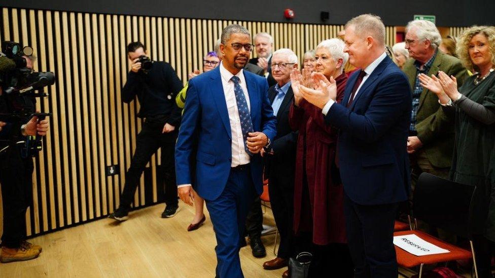 Vaughan Gething walking to the podium after being elected as the next First Minister of Wales