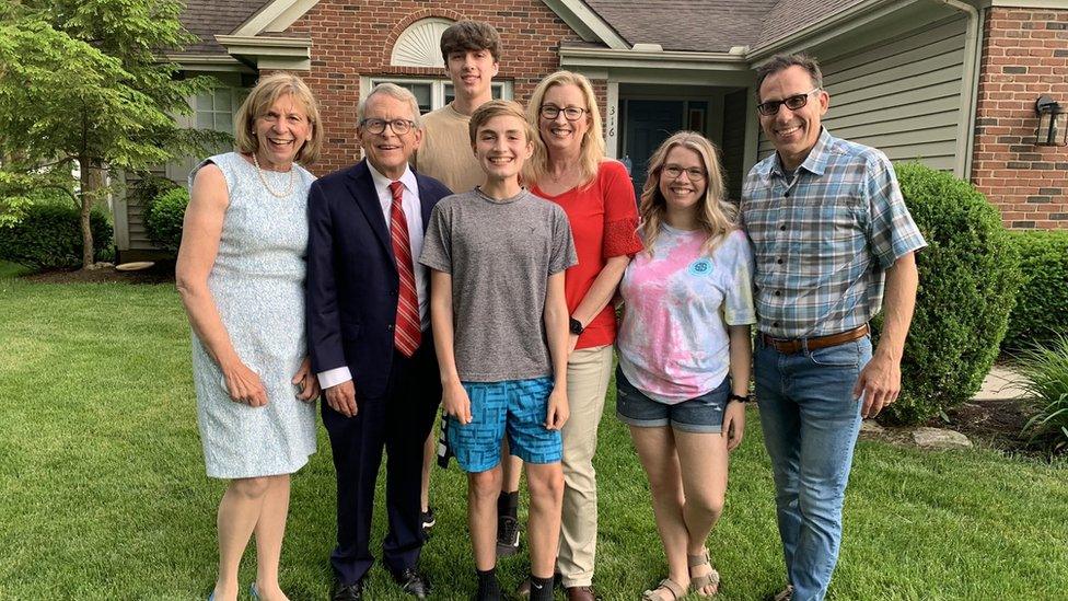 Gov Mike DeWine and college scholarship winner Joseph Costello