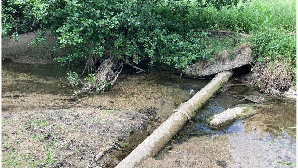 Pipe in river bed