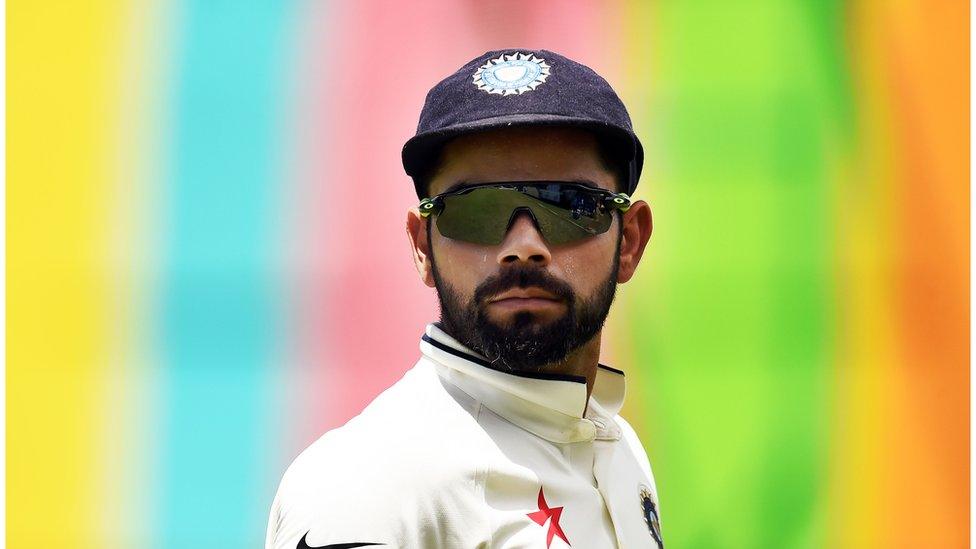 Indian cricket team captain Virat Kohli watches his teammates during the three-day tour match between India and WICB President's XI squad at the Warner Park stadium in Basseterre, Saint Kitts, on July 14, 2016.