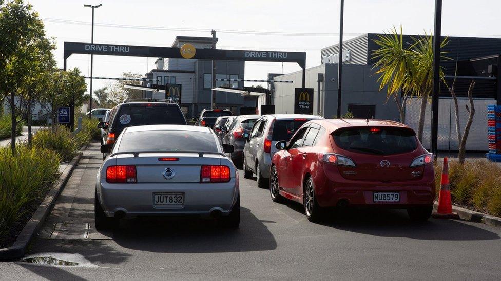 Cars line up at a McDonald's drive-through in Auckland, New Zealand, as people are allowed to get takeaway food again