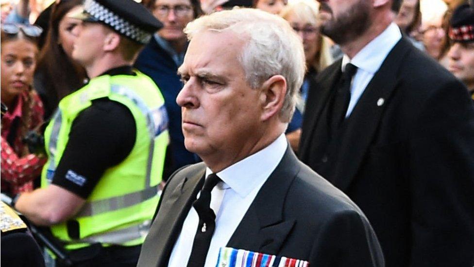 Prince Andrew walking behind hearse