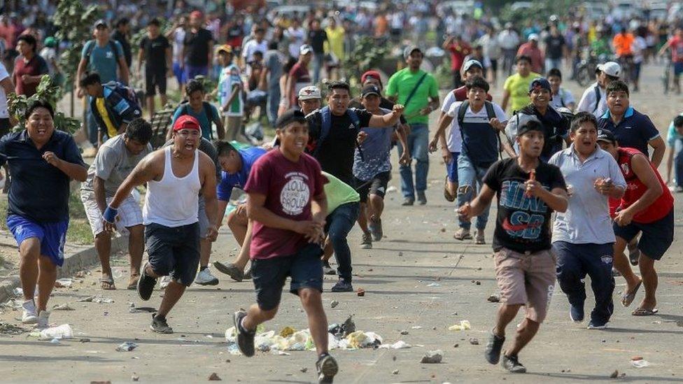 Supporters of Bolivian opposition candidate Carlos Mesa and of president Evo Morales clash over disputed poll results, in Santa Cruz, Bolivia, on October 23, 2019.